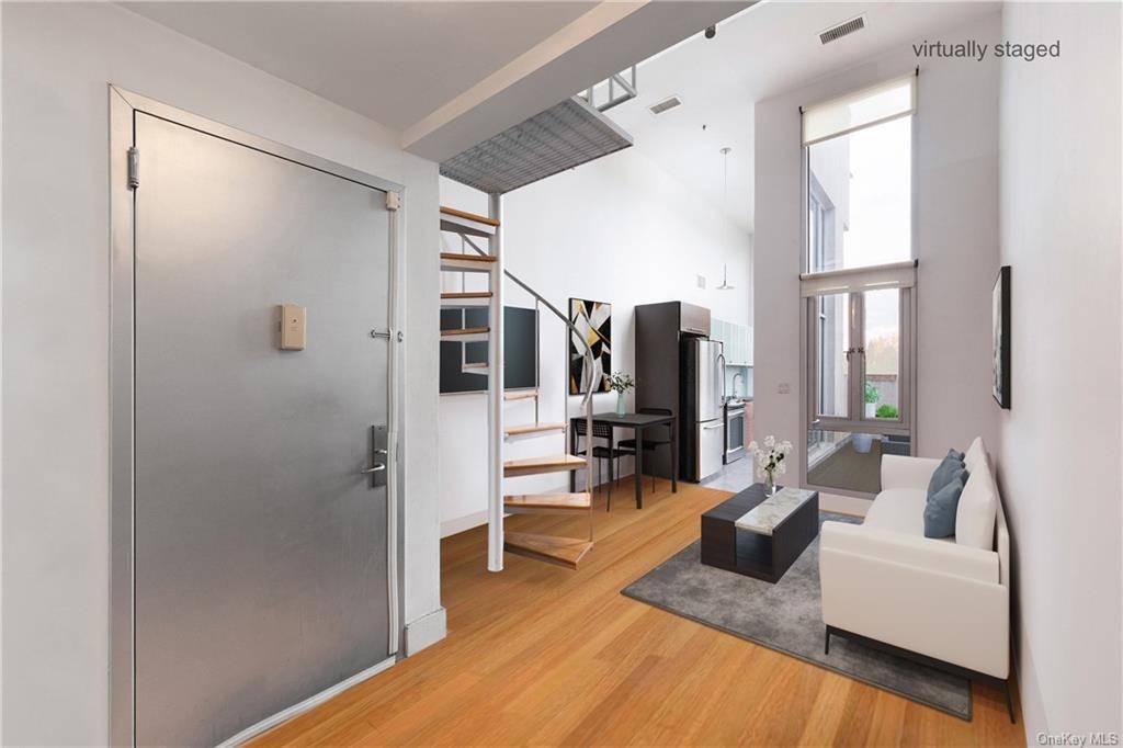 Nestled in the heart of Williamsburg, Brooklyn, this exceptional 2 bedroom, 2 bathroom loft style duplex condo is a masterpiece of contemporary living.