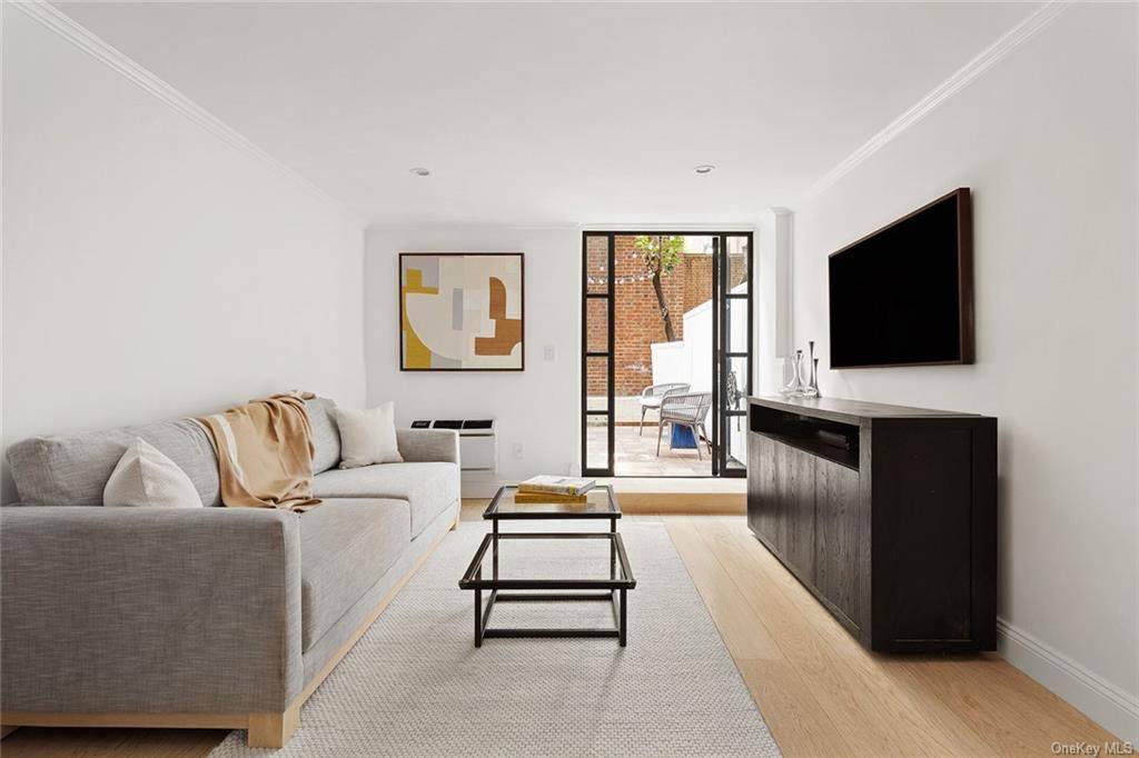 Welcome home to unit GC at 435 E 86th St, an Upper East Side garden triplex, that feels more like a cottage than an apartment.