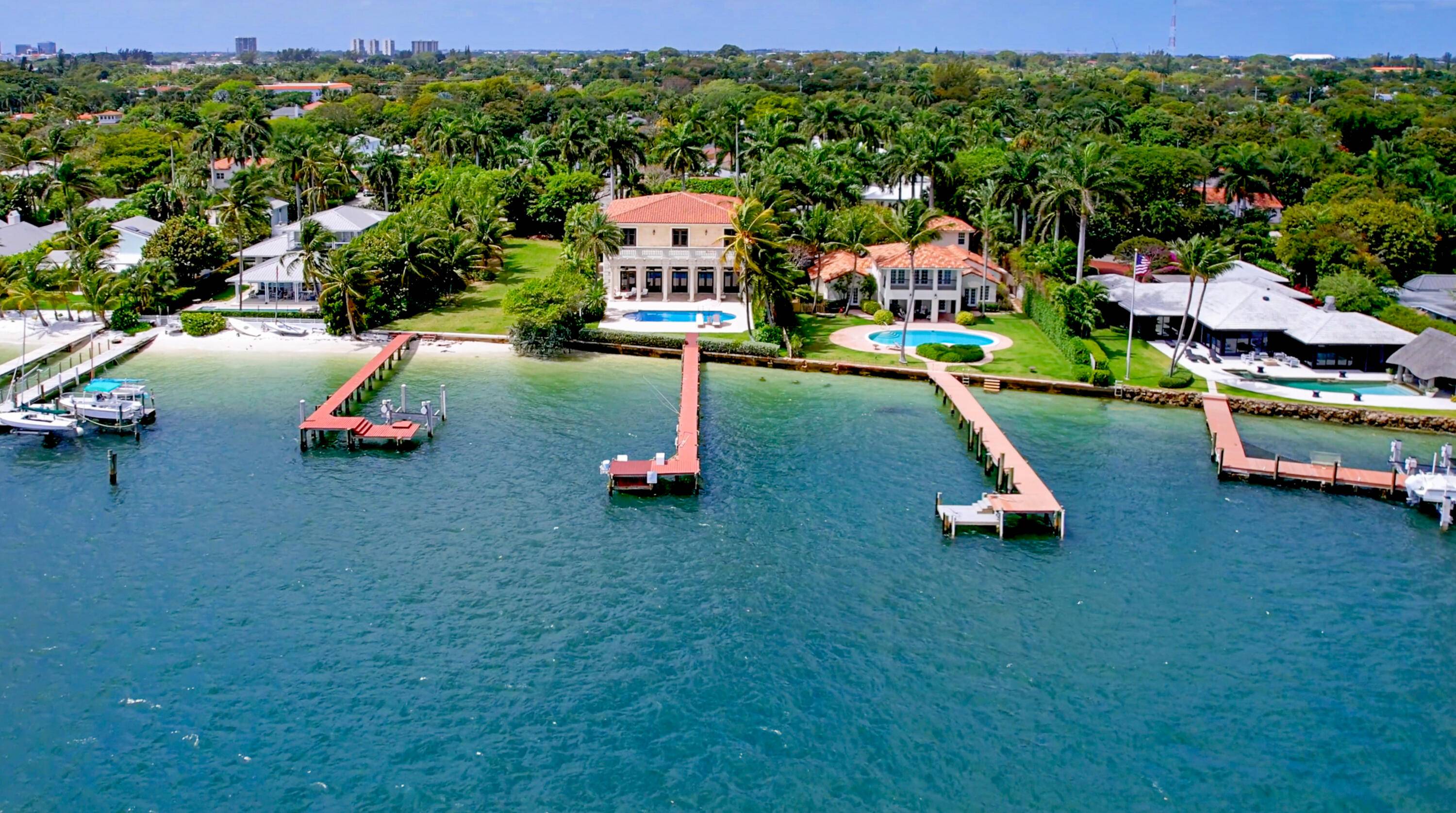Enjoy wide open intracoastal views overlooking Palm Beach estate homes at this rare direct waterfront 6BR 6.