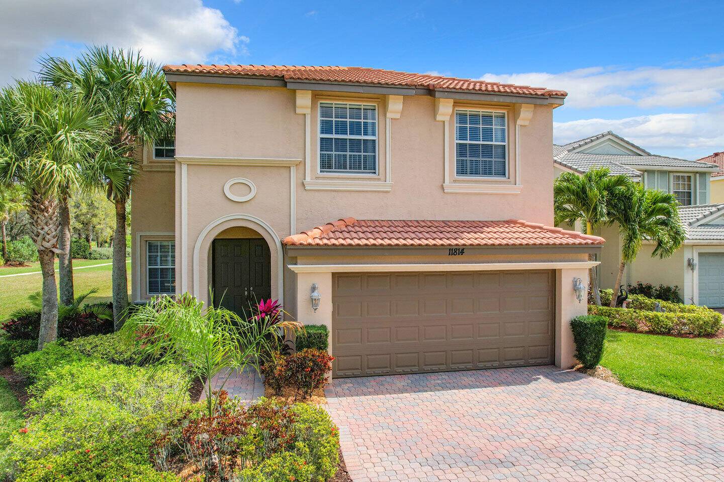 Spectacular private 4 bedroom, 3 bath POOL home nestled on a premium waterfront lot within the exclusive gated community of Town Park at Tradition.