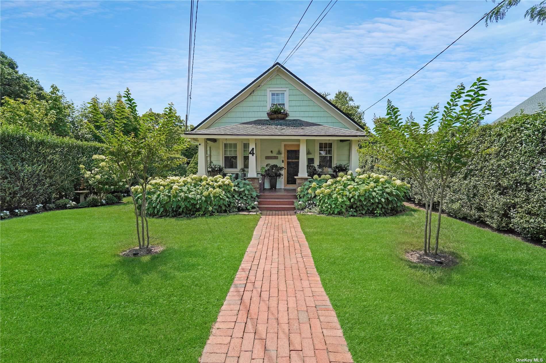 Set on meticulously landscaped grounds, this farmhouse style cottage offers a picturesque exterior and a beautifully renovated interior with modern amenities abound.