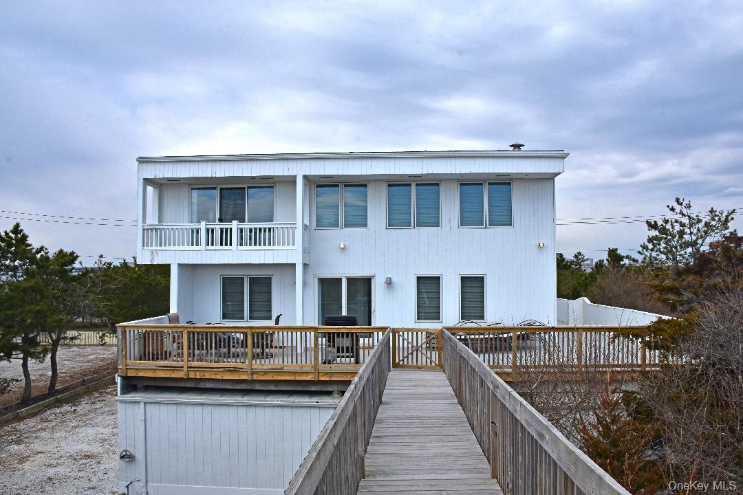 Rear view of house featuring a balcony