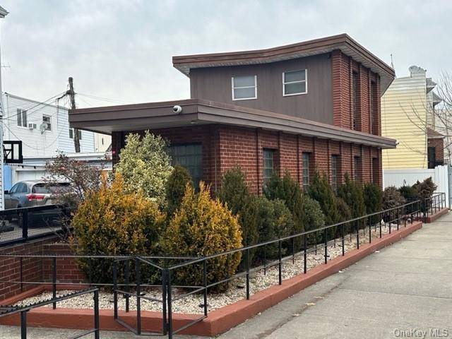Welcome to this unique mid century modern brick house in the heart of Maspeth.