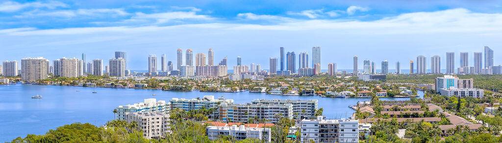Welcome to luxury living at our concierge waterfront condo, Every day is a picturesque escape amidst the stunning Eastern skyline views of Sunny Isles, Maule Lake, the serene expanse of ...