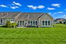Expansive rear lawn with a peaceful, private setting