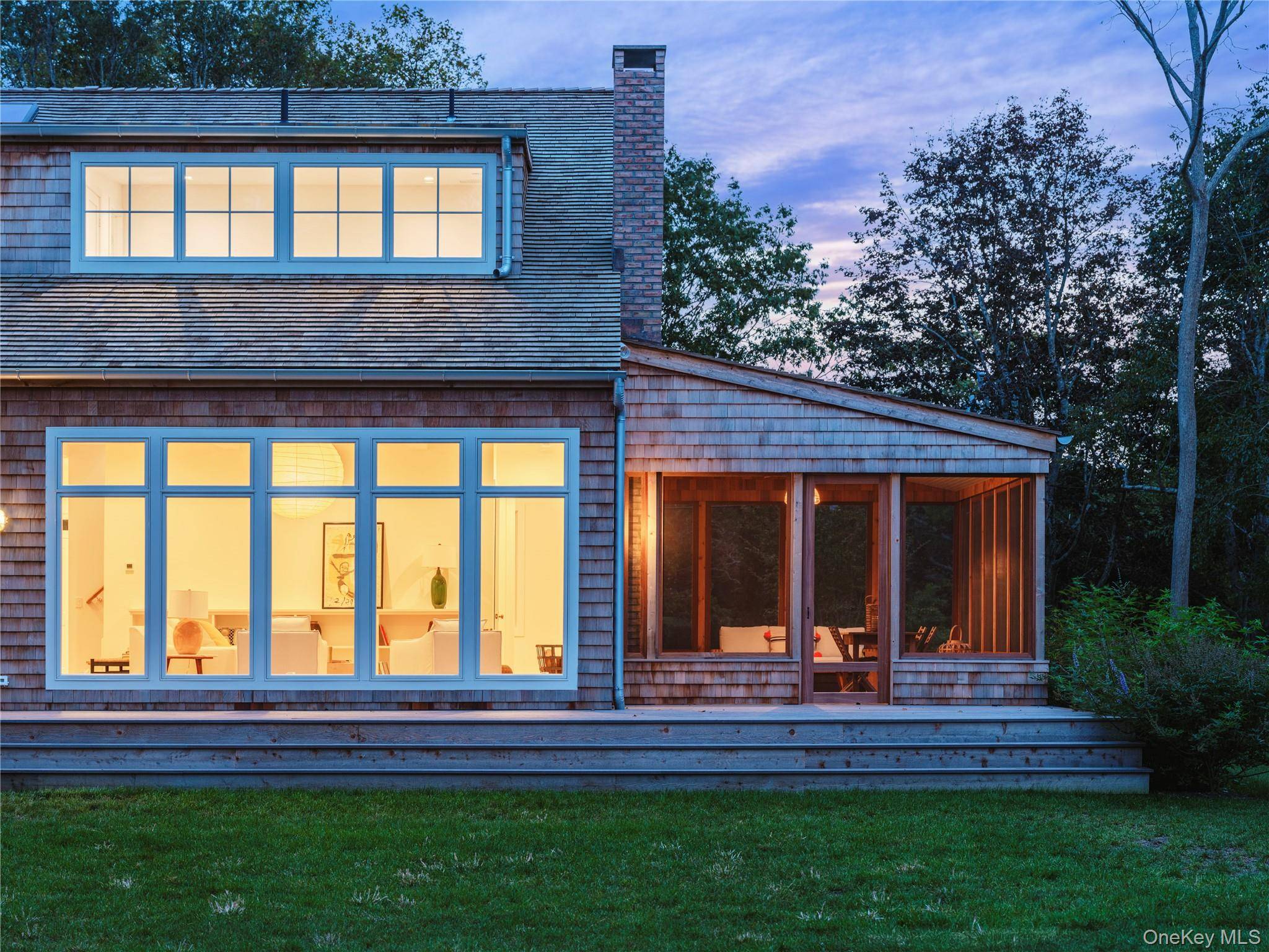Located on picturesque Park Avenue in Mattituck, this bespoke new construction sits on a generous 1.