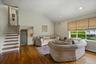 Hardwood flooring extending throughout the space