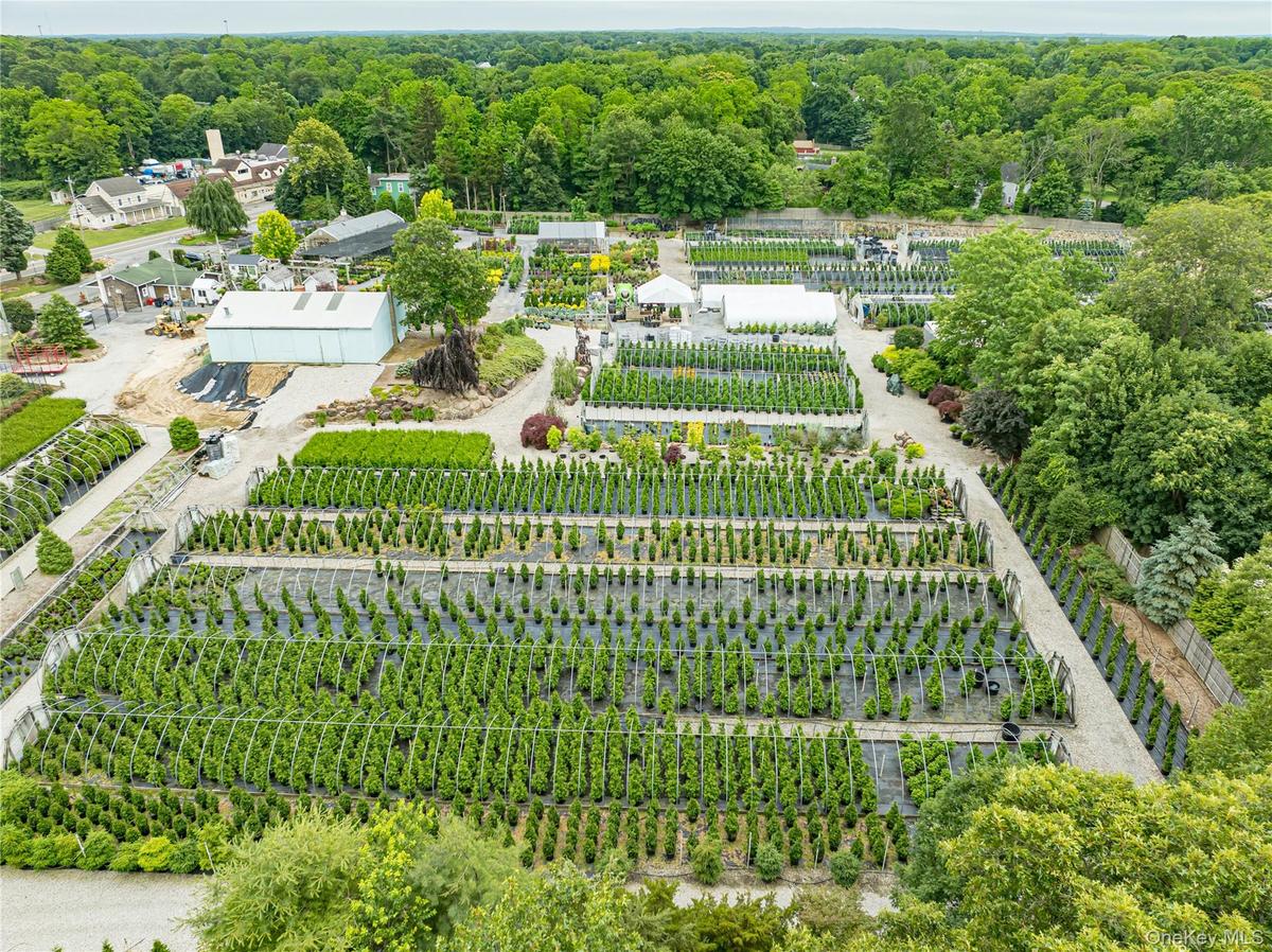 Aerial overview of property's location with extensive farmland and rural landscape