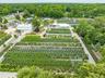 Aerial overview of property's location with extensive farmland and rural landscape