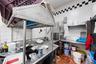 Kitchen featuring tile walls, light tile patterned flooring, decorative backsplash, and island range hood