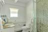 Bathroom with a stall shower, vanity, and tile patterned floors