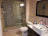Ensuite Full bath featuring a walk in shower
