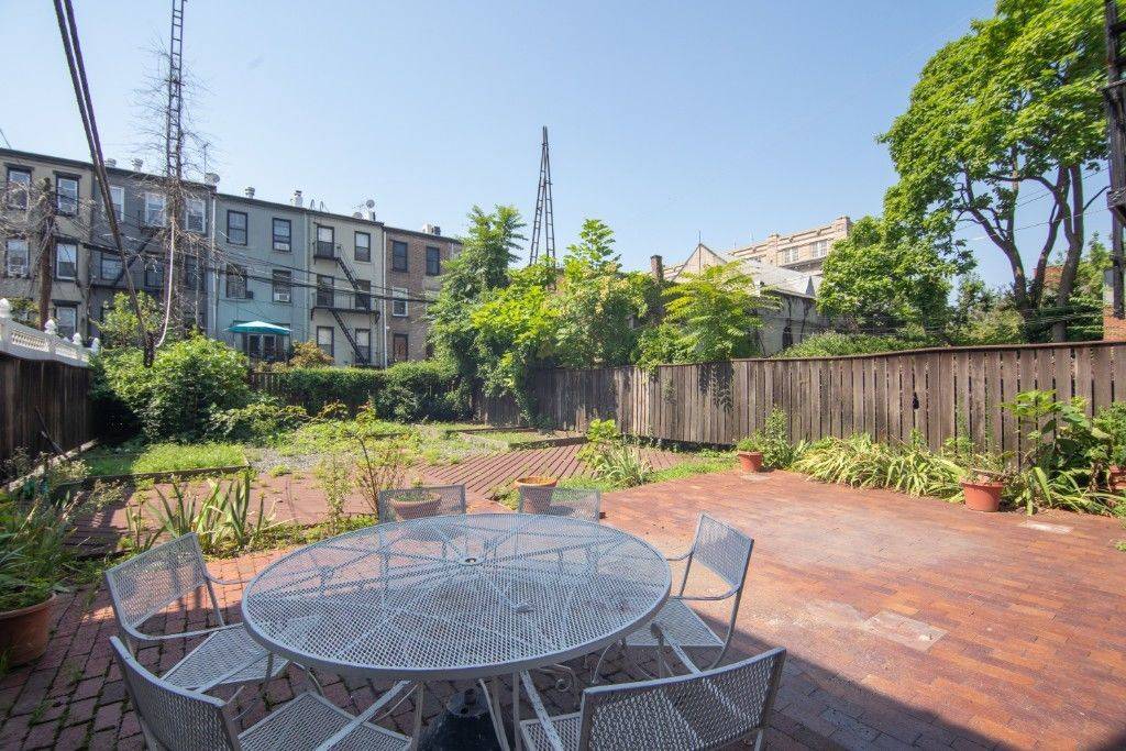 34' Extra Wide Brownstone with 4 tall windows spanning across both front amp ; back of this Garden Parlor DUPLEX This approximately 2, 700 sq ft duplex apartment features a ...