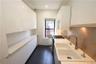 Kitchen featuring white cabinets, light countertops, stainless steel gas range oven, modern cabinets, and recessed lighting