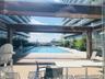 View of pool featuring a wooden deck