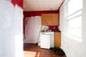 Kitchen featuring dark wood-type flooring, a drop ceiling, and washer / clothes dryer