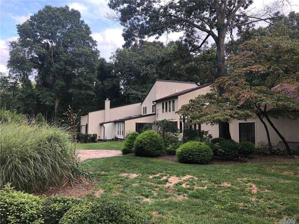Beautiful Large Contemporary Privately Set On Over 2 Acres Of Lush Gardens And Pathways In Old Brookville.