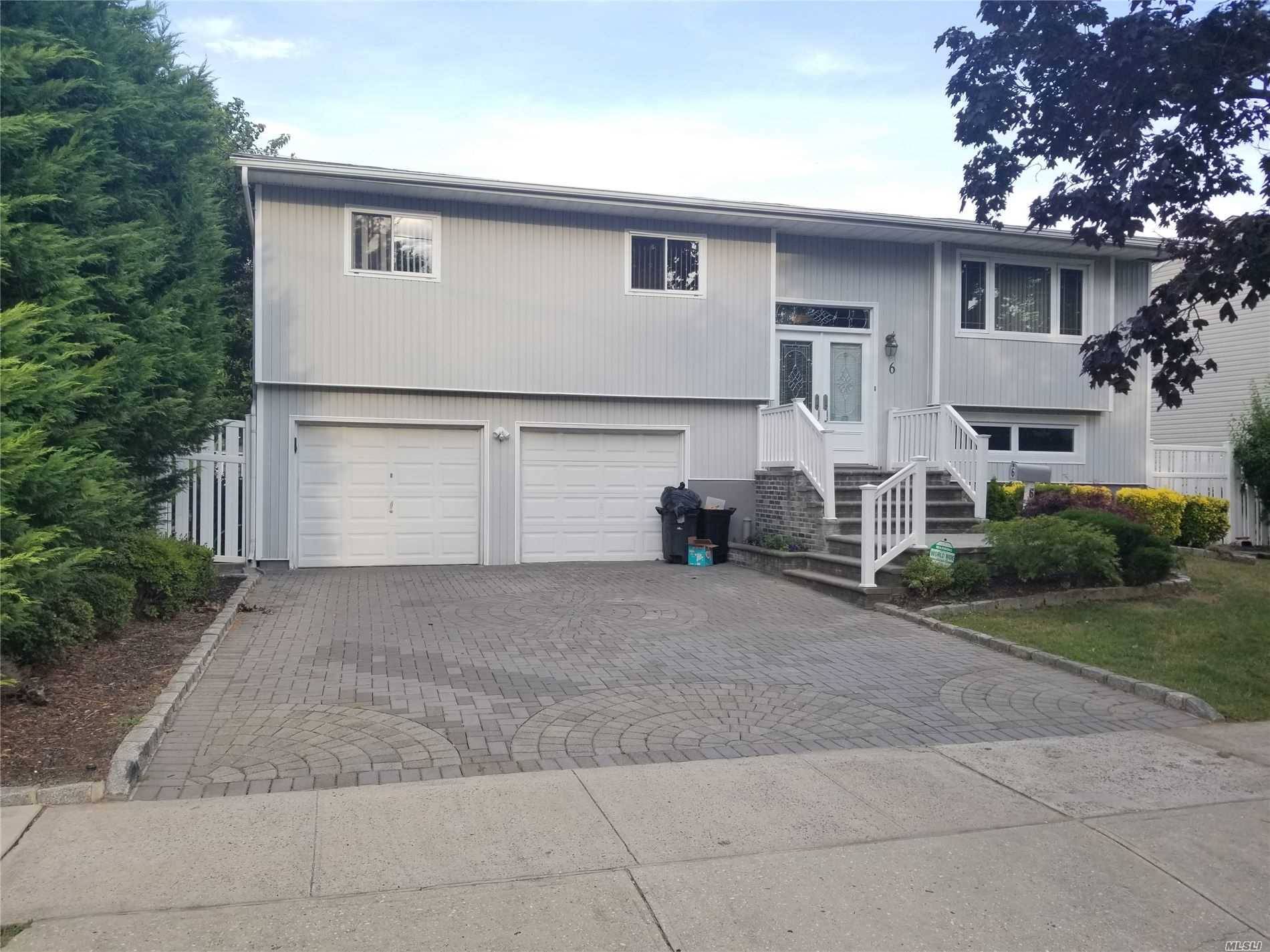 Lovely Hi ranch on a quiet street 4 bedroom amp ; 2 baths, new kitchen with a large window, access to the deck from the dining room, hardwood floor throughout, ...