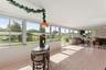 Sun room with view of boat house.