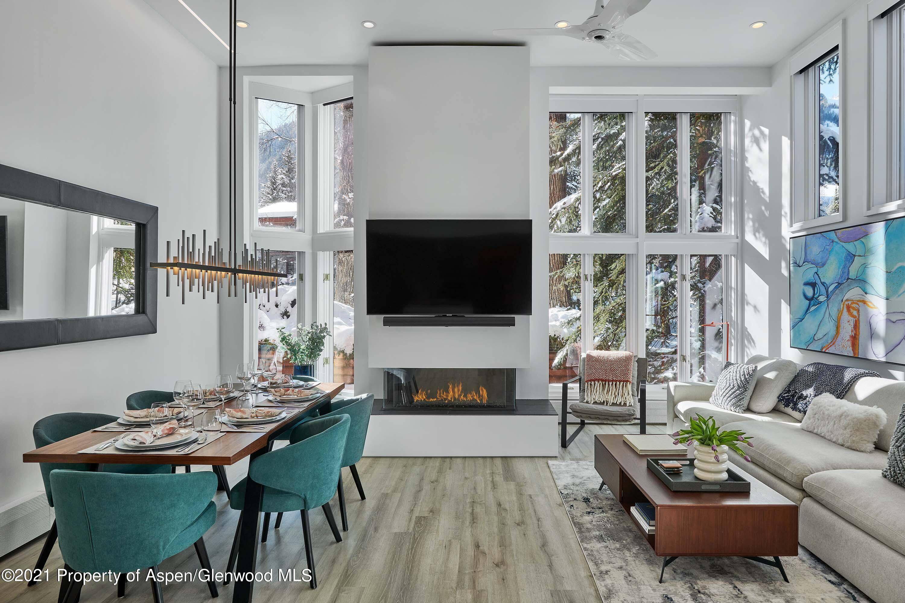 Newly remodeled and thoughtfully designed by Kim Raymond Architecture Interiors, this stunning contemporary condominium features high ceilings in the living room, a three sided gas fireplace, with all new furnishings, ...