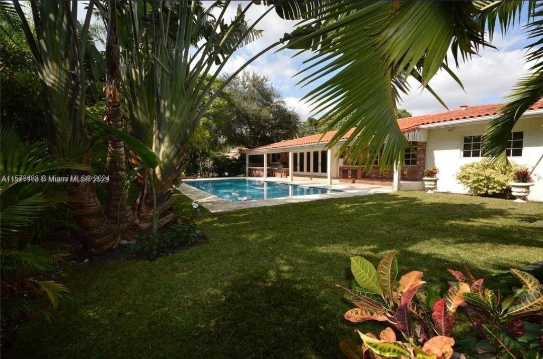 Located in the heart of Coral Gables, this lovely house offers a warm and inviting atmosphere that you'll be proud to call your own.