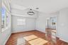 Second Floor Primary Bedroom with full en-suite and large closets with custom cabinets
