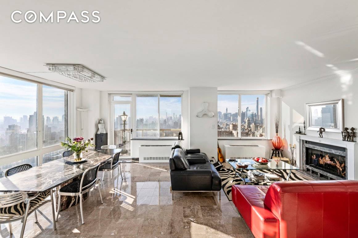 High on a corner overlooking the Manhattan skyline featuring dramatic cityscape and water views, is this truly unique triplex penthouse.