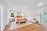 Bedroom with light wood-style floors, access to exterior, recessed lighting, and multiple windows