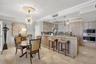 Spectacular kitchen w/ custom bleached walnut veneer cabinetry by renowned Chicago based millworker. Grain matches from top to bottom. Wolf induction