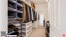 The walk-in closet provides ge