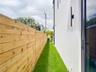 (as of April 8, 2026) side pathway to backyard and cabana bath entry.