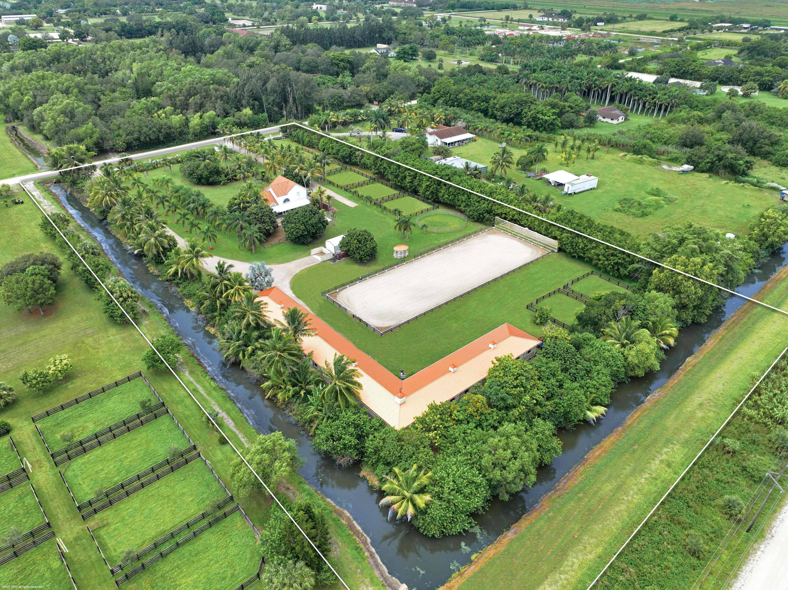 An amazing opportunity to own a beautiful turnkey horse farm in Wellington's horse country !