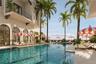 The 70-foot resort-style pool at Mira Mar is complemented by a lounging area with a spacious sun deck, hot tub, and dedicated towel service, creating