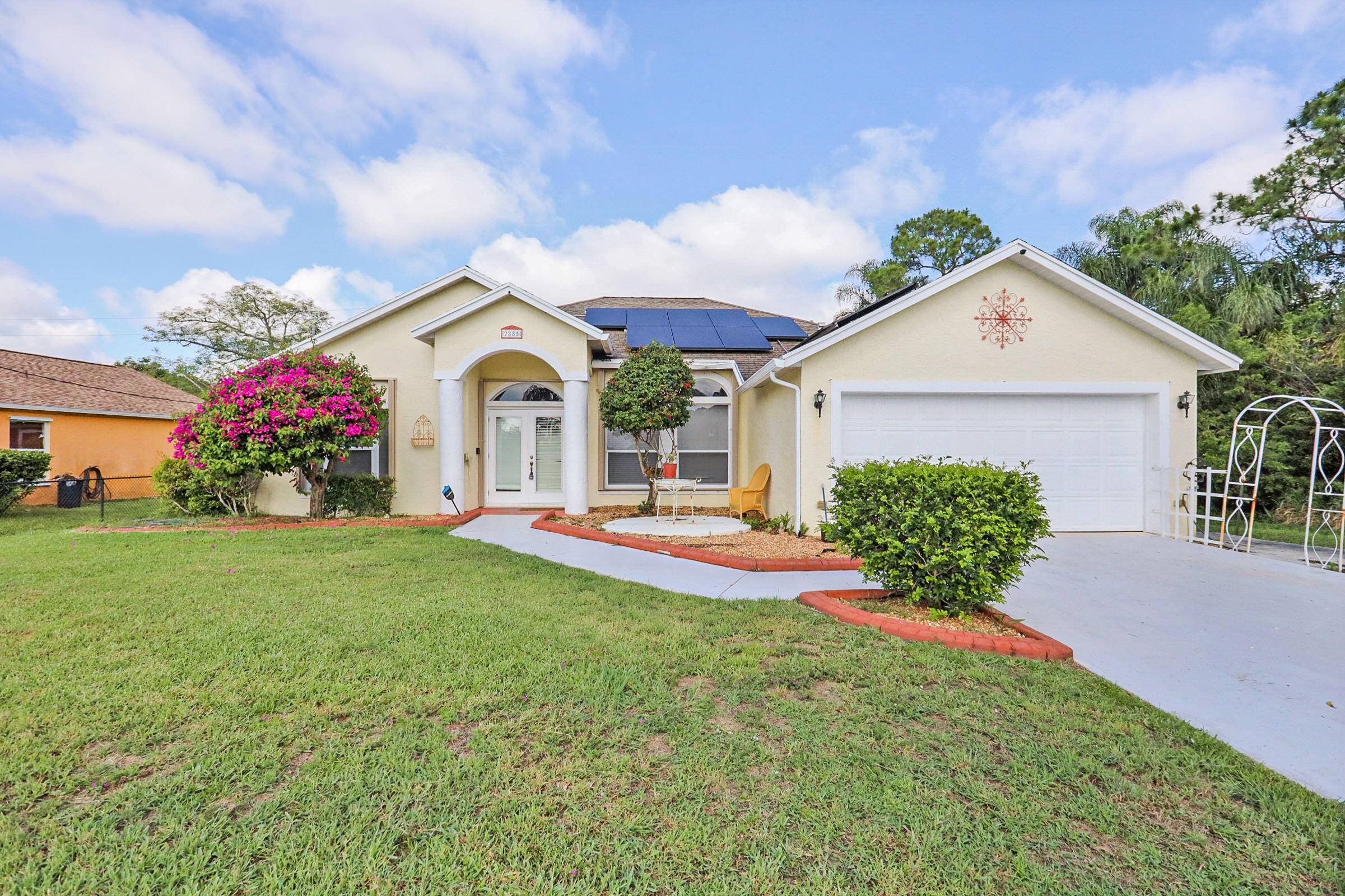 This amazing 3 2 2 pool home has a huge, screened back porch where you can spend your days and evenings enjoying the Florida weather.