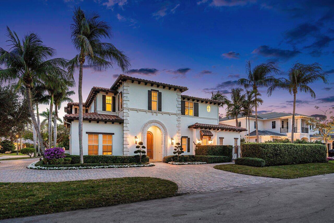 1625 Sabal Palm Drive This Elegant transitional Estate is located on a corner interior lot on a serene quiet street in the Prestigious Royal Palm Yacht Country Club.