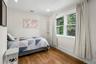 Bright bedroom with a walk-in closet.
