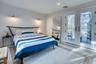 Bedroom featuring french doors, visible vents, and access to exterior