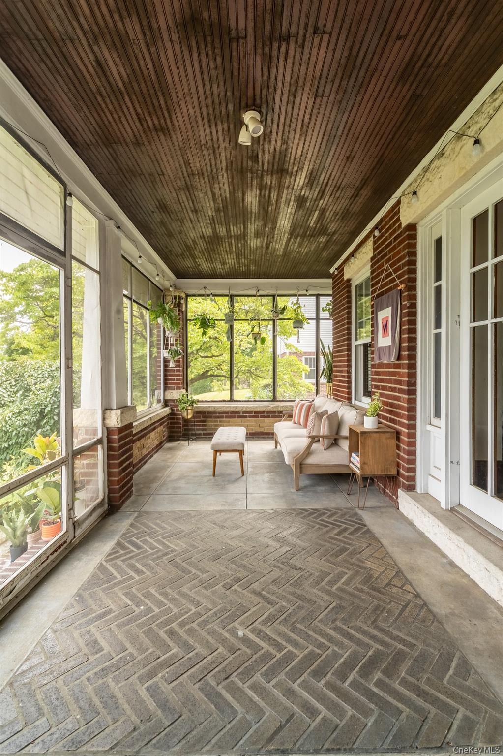 Screen-in porch at front of house.