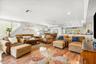 Open Floor Plan with Great Room, Dining Area, Half Bath, and Seating at Counter Bar
