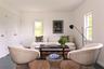 Living area with baseboards and wood finished floors