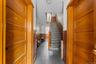 Stairway featuring a wainscoted wall