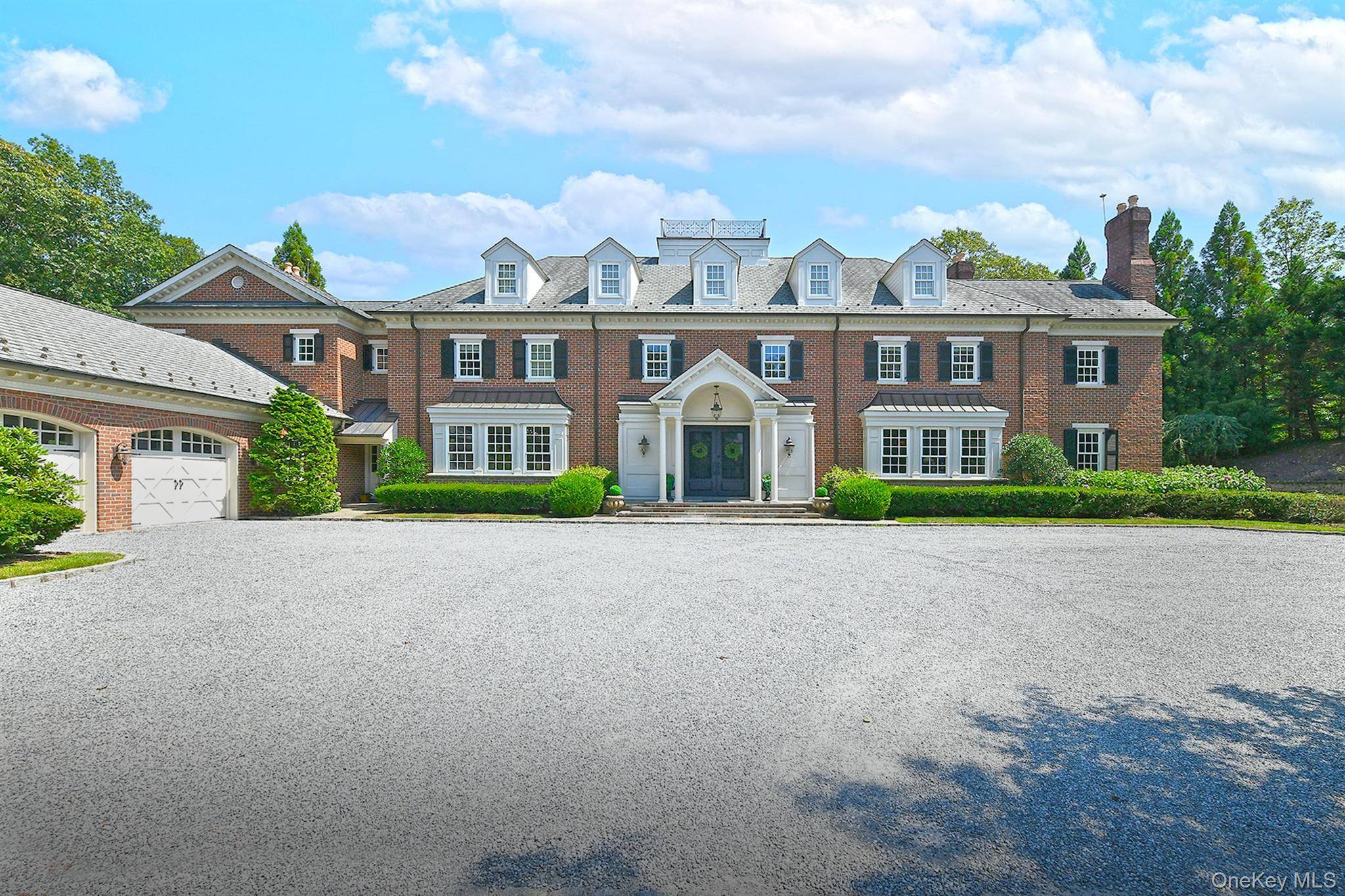 Set atop one of the highest points on Long Island along the Nassau County border, this private all brick estate offers a rare combination of serenity, grandeur, and craftsmanship.