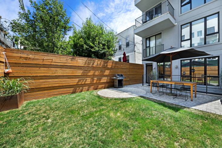 Outdoor Lover's Dream ! Welcome home to your Garden Duplex with Private Back Yard AND breathtaking common Roof Deck.