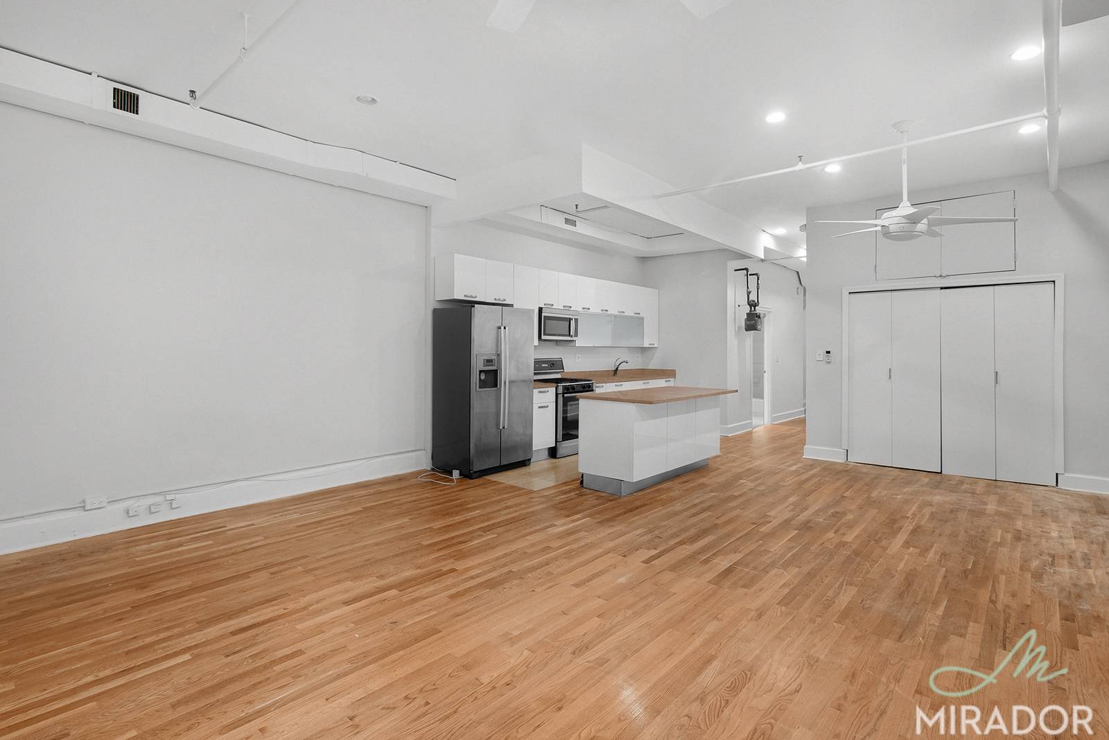 This loft like apartment features all the benefits of a condo with the privacy of a boutique rental building.