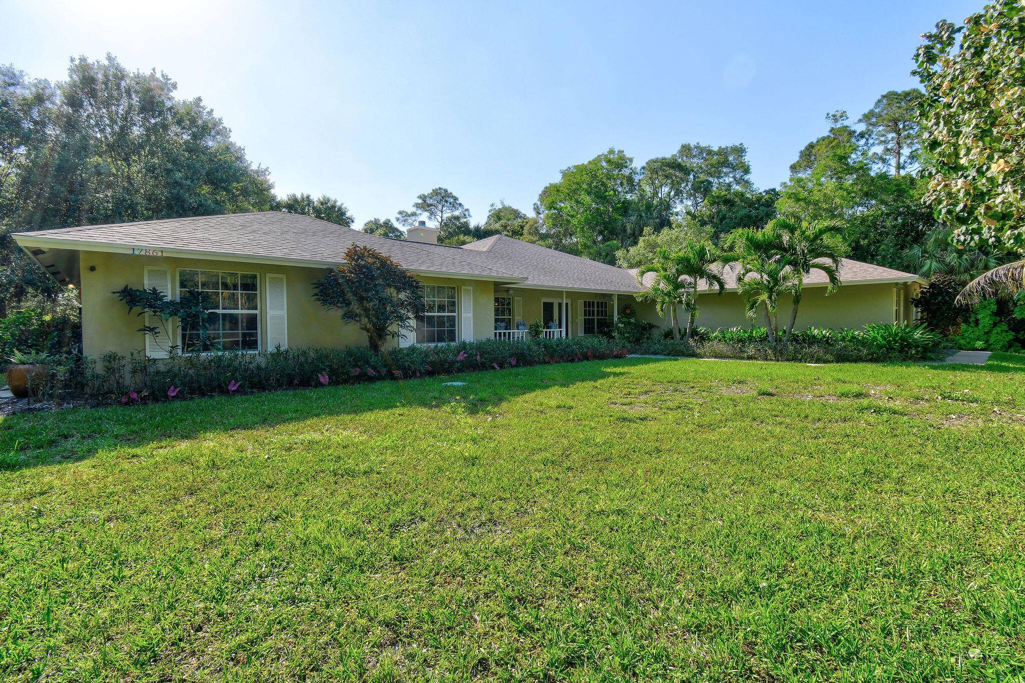 Enjoy the Florida lifestyle in this spacious 4 bedroom, 2 bathroom, a den and 4 car garage residence.