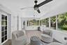 Sunroom has a ceiling fan and light on dimmer, a recently installed A/C split unit for just this (large) room, newly installed custom automatic shades