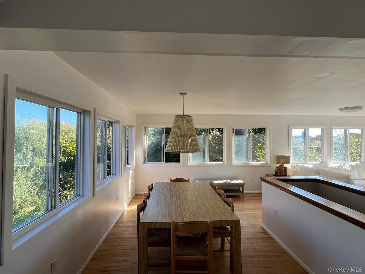 Dining room featuring wood finished floors and baseboards