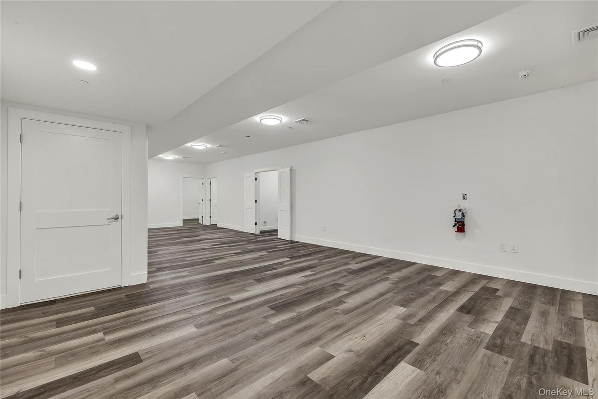 Finished below grade area featuring wood finished floors
