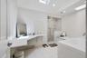 Primary Bedroom En Suite - Plenty of counter space, double vanity and radiant heated tile floor.