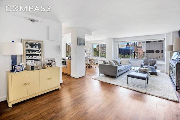 Rarely available, bright and spacious 2 bedroom, 2 bath corner apartment featuring sweeping views of the West Village awaits.